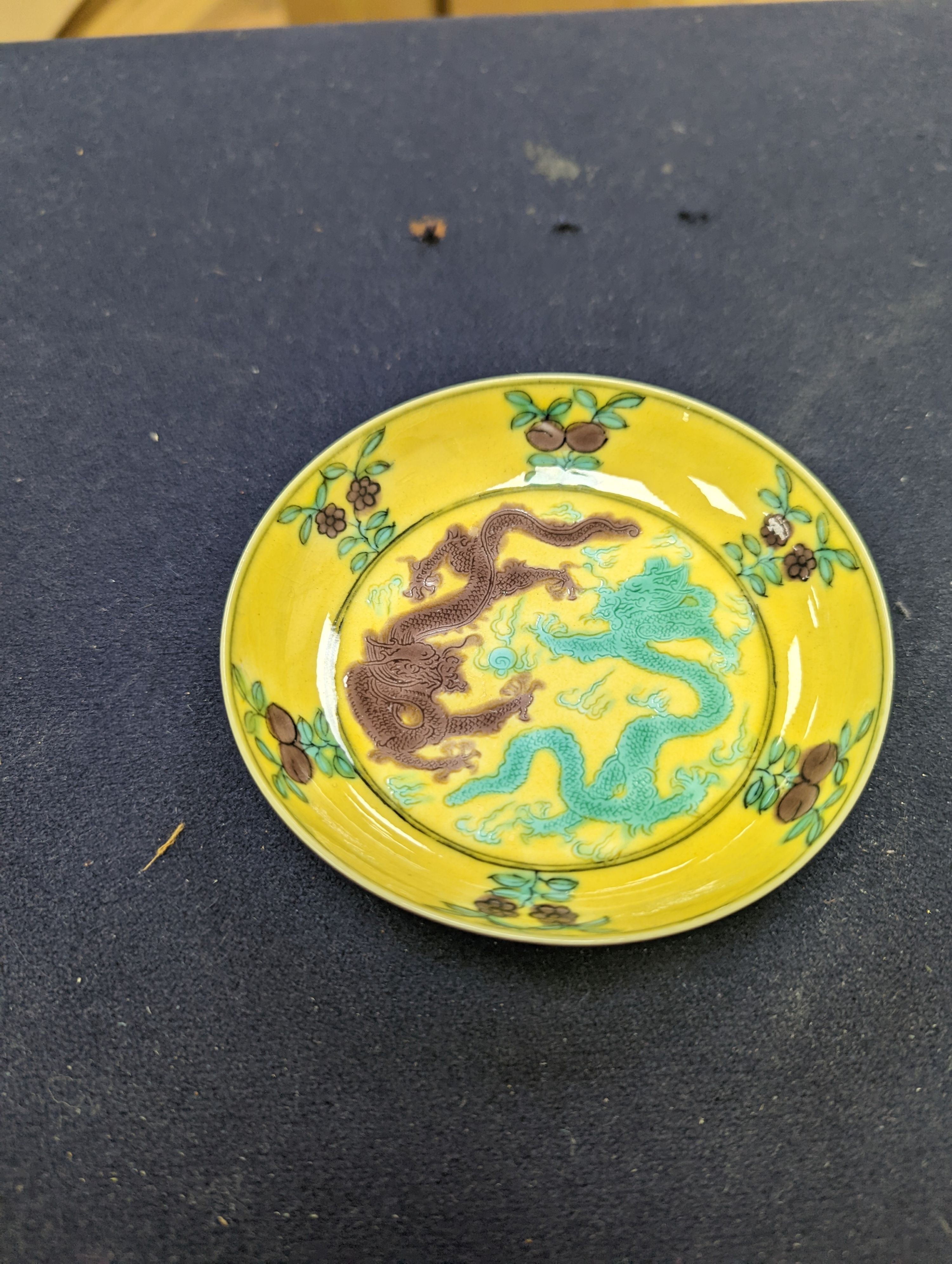 A pair of Chinese yellow, green and aubergine dragon dishes, Guangxu marks, 10cm.